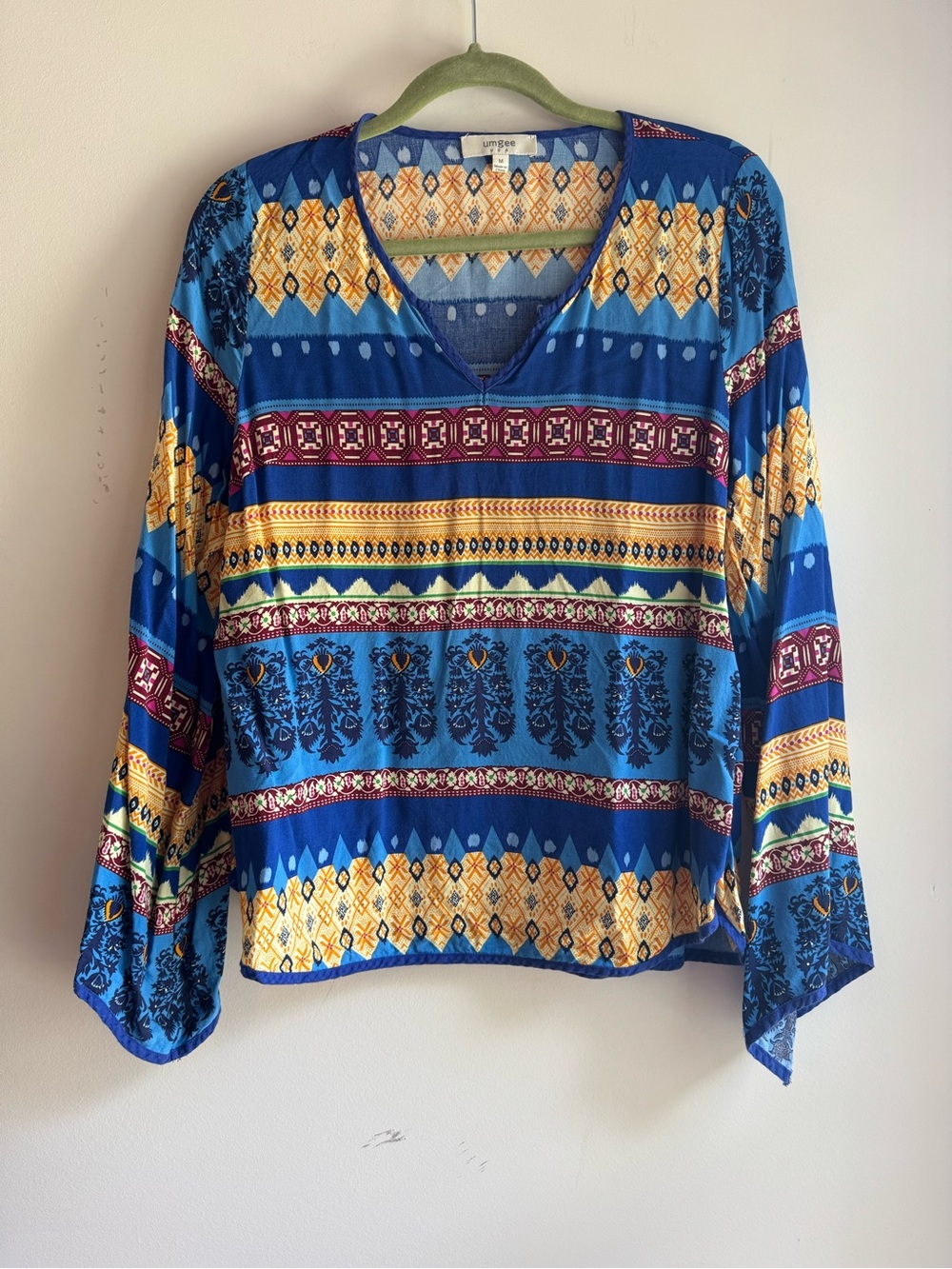 Umgee Blue V‑Neck Patterned Tunic with Yellow and Burgundy Accents